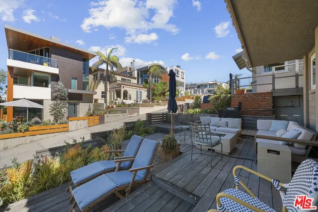 a view of a patio with couches table and chairs