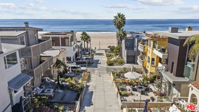 a view of a patio with table and chairs potted plants