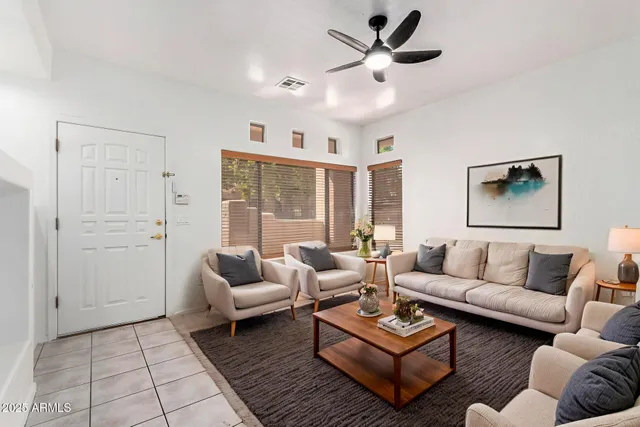 a living room with furniture and a large window