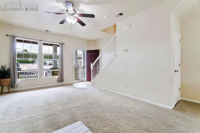 a view of empty room with windows