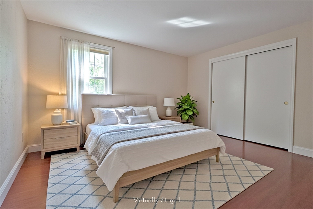 300 Falmouth Road, Unit 18E Mashpee, MA 02649 - Photo 15 of 33 a bedroom with a large bed and a window