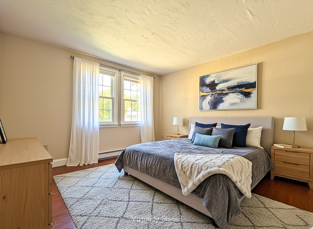 300 Falmouth Road, Unit 18E Mashpee, MA 02649 - Photo 17 of 33 a bedroom with a bed a rug and a window
