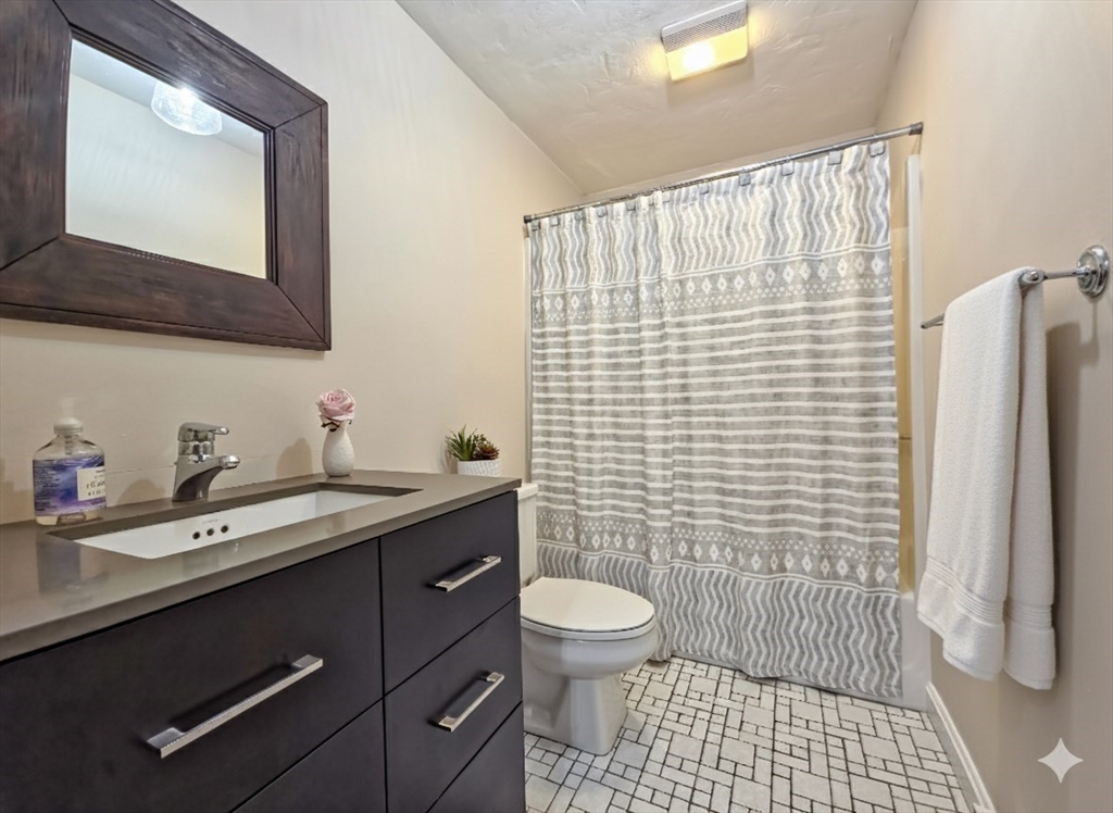 300 Falmouth Road, Unit 18E Mashpee, MA 02649 - Photo 20 of 33 a bathroom with a sink toilet and shower