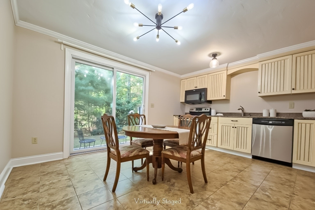 300 Falmouth Road, Unit 18E Mashpee, MA 02649 - Photo 6 of 33 a view of a dining room with furniture window and outside view