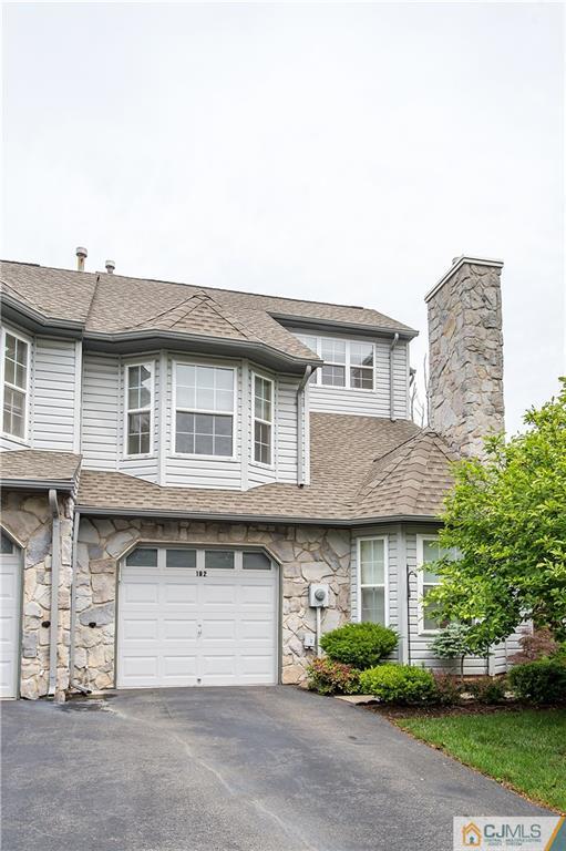 192 Nebula Road Piscataway, NJ 08854 - Photo 2 of 19 a front view of a house with a garden