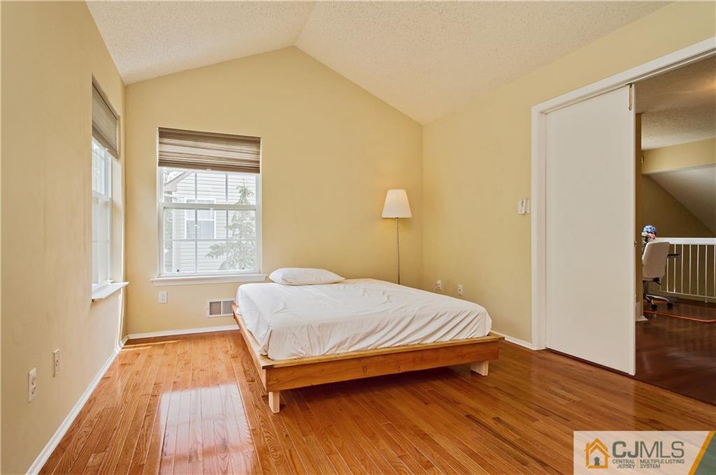 192 Nebula Road Piscataway, NJ 08854 - Photo 13 of 19 a bedroom with a bed and a rug