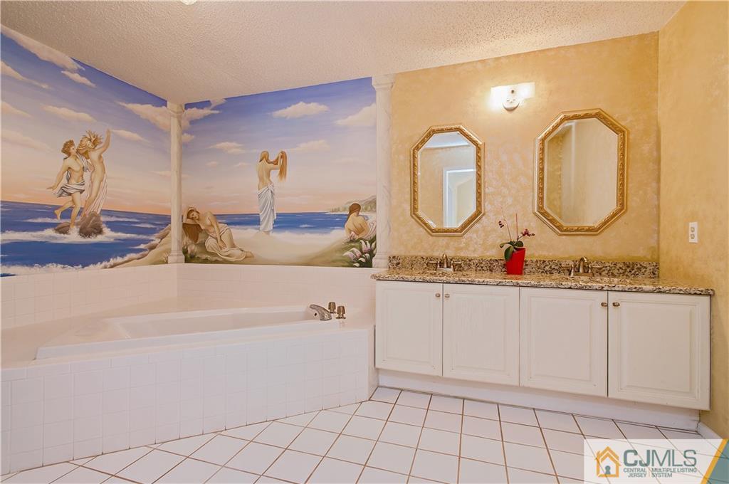 192 Nebula Road Piscataway, NJ 08854 - Photo 15 of 19 a bathroom with a sink and mirror