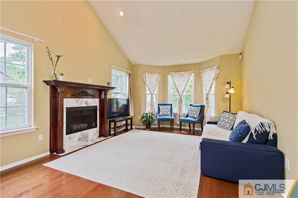 192 Nebula Road Piscataway, NJ 08854 - Photo 3 of 19 a living room with furniture and a fireplace