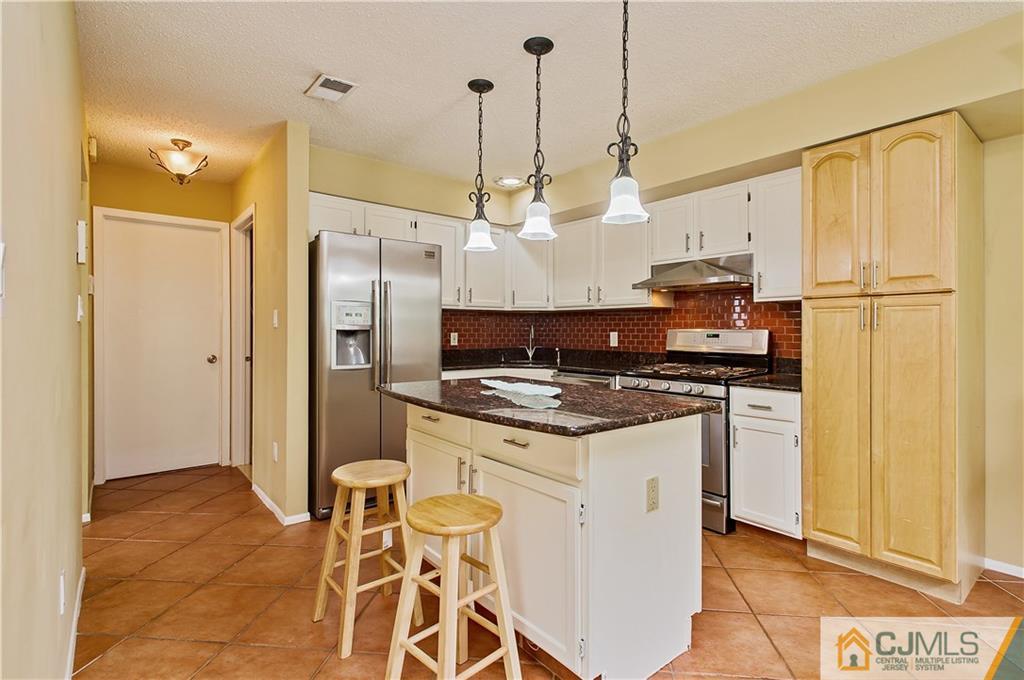 192 Nebula Road Piscataway, NJ 08854 - Photo 5 of 19 a kitchen with stainless steel appliances granite countertop a stove a refrigerator and a refrigerator