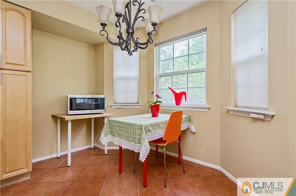 192 Nebula Road Piscataway, NJ 08854 - Photo 7 of 19 a workspace with furniture window and wooden floor