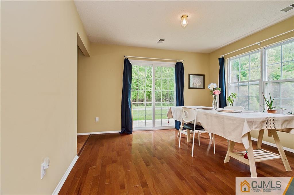 192 Nebula Road Piscataway, NJ 08854 - Photo 9 of 19 a dining room with furniture and wooden floor