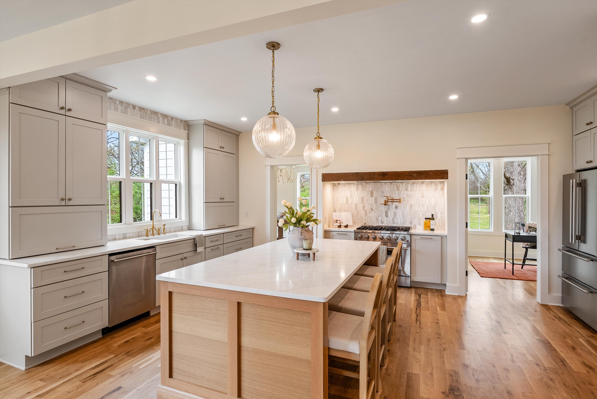 1629 Cairo Road Gallatin, TN 37066 - Photo 12 of 51 a large kitchen with kitchen island a large island a sink a stove and wooden floor