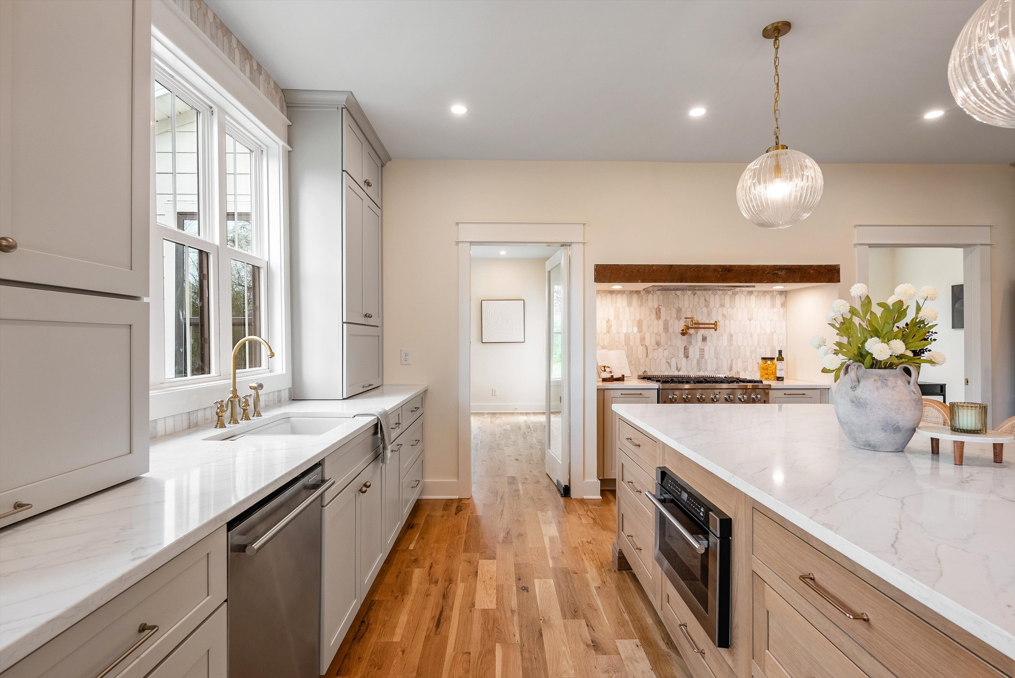 1629 Cairo Road Gallatin, TN 37066 - Photo 14 of 51 a large kitchen with kitchen island white cabinets and a chandelier