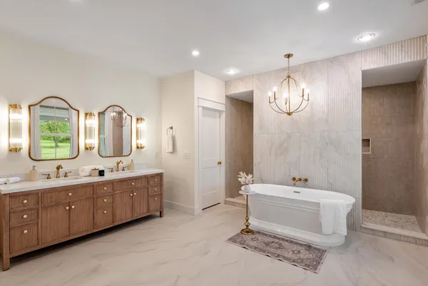 a bathroom with a double vanity sink and a mirror