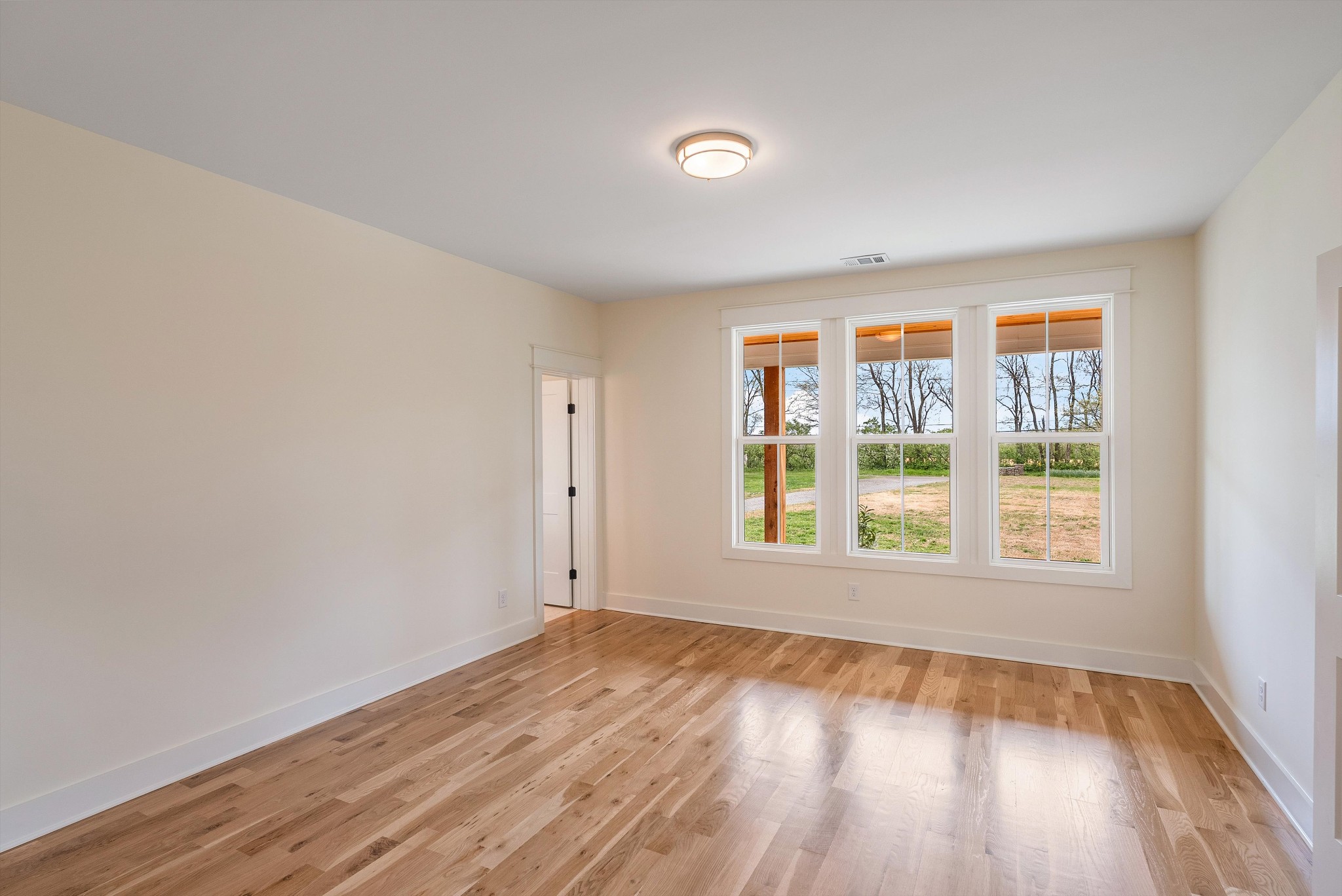 1629 Cairo Road Gallatin, TN 37066 - Photo 35 of 51 an empty room with wooden floor and windows