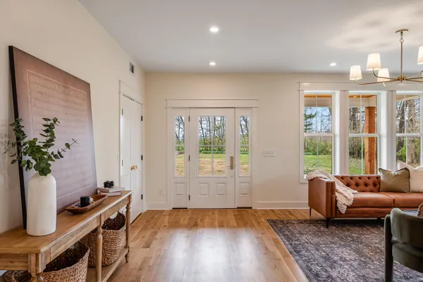 a living room with furniture window and wooden floor