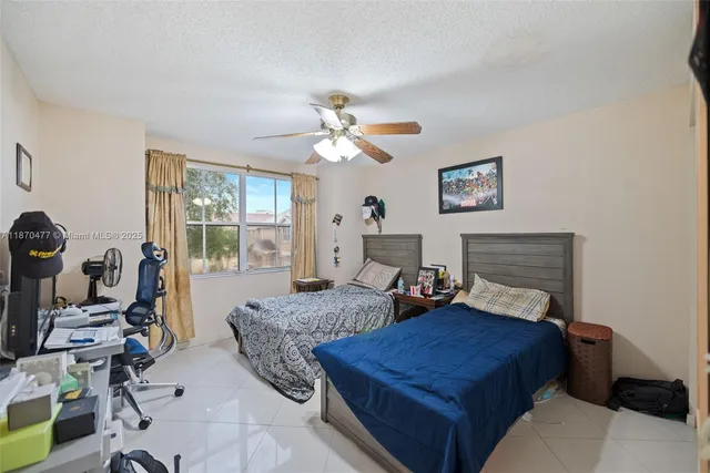 a bedroom with furniture and a chandelier