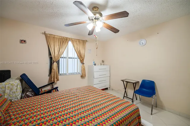 a bedroom with a bed and a cabinets