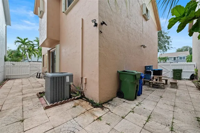 a view of potted plant in front of a building