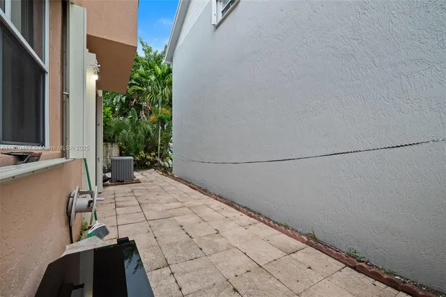 a view of a backyard of the house