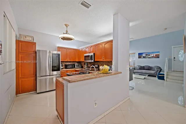 a kitchen that has a lot of cabinets in it