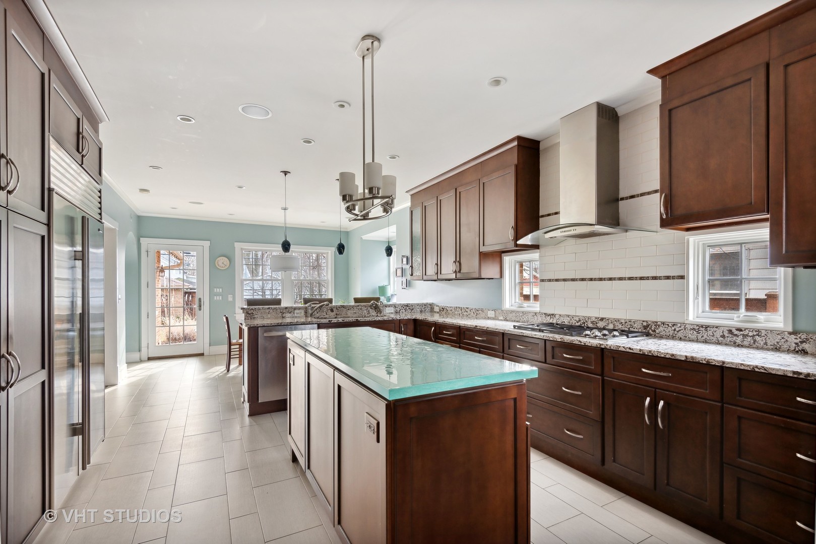 1601 Central Avenue Wilmette, IL 60091 - Photo 13 of 32 a kitchen with stainless steel appliances granite countertop a sink and stove