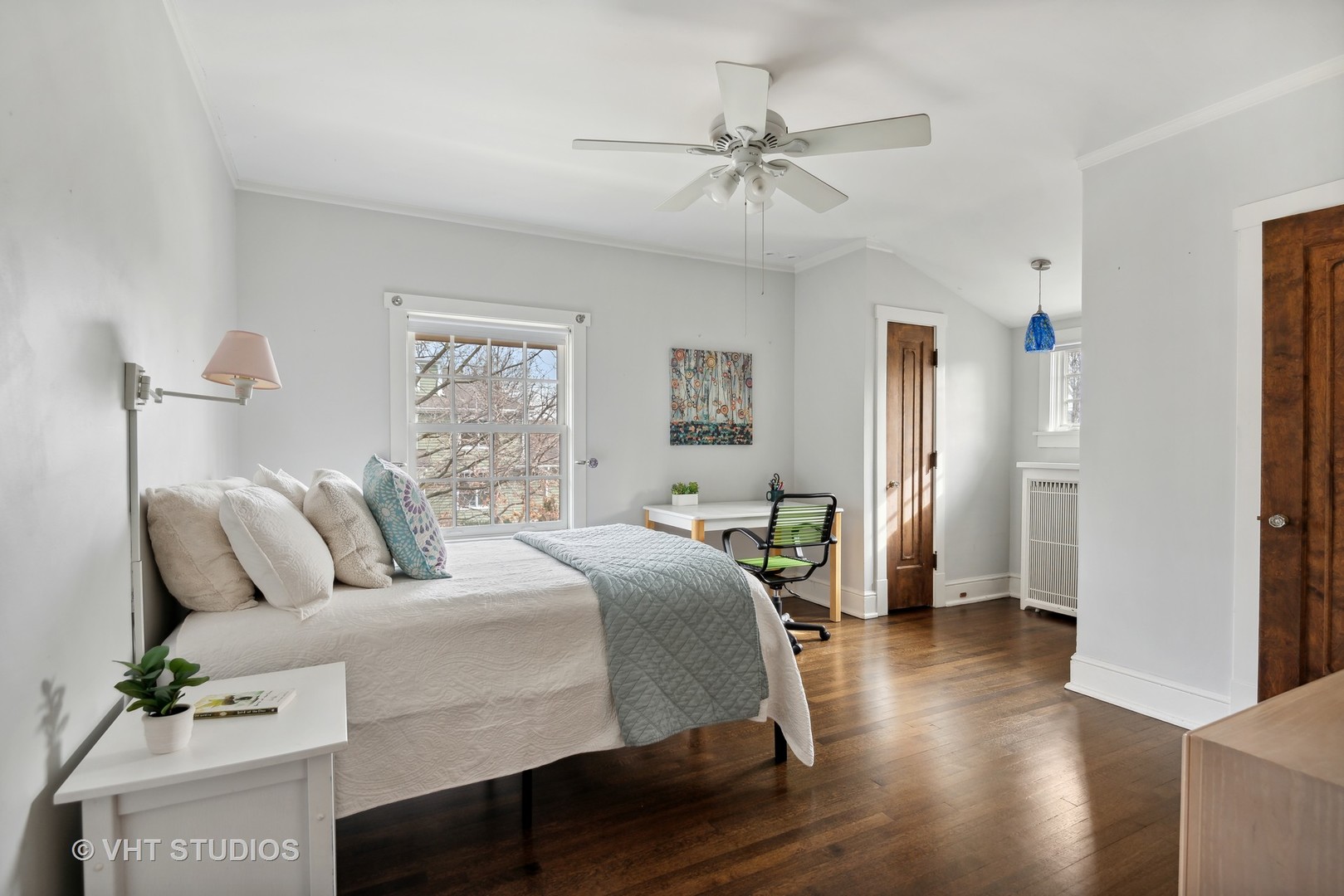 1601 Central Avenue Wilmette, IL 60091 - Photo 18 of 32 a bedroom with a bed and wooden floor