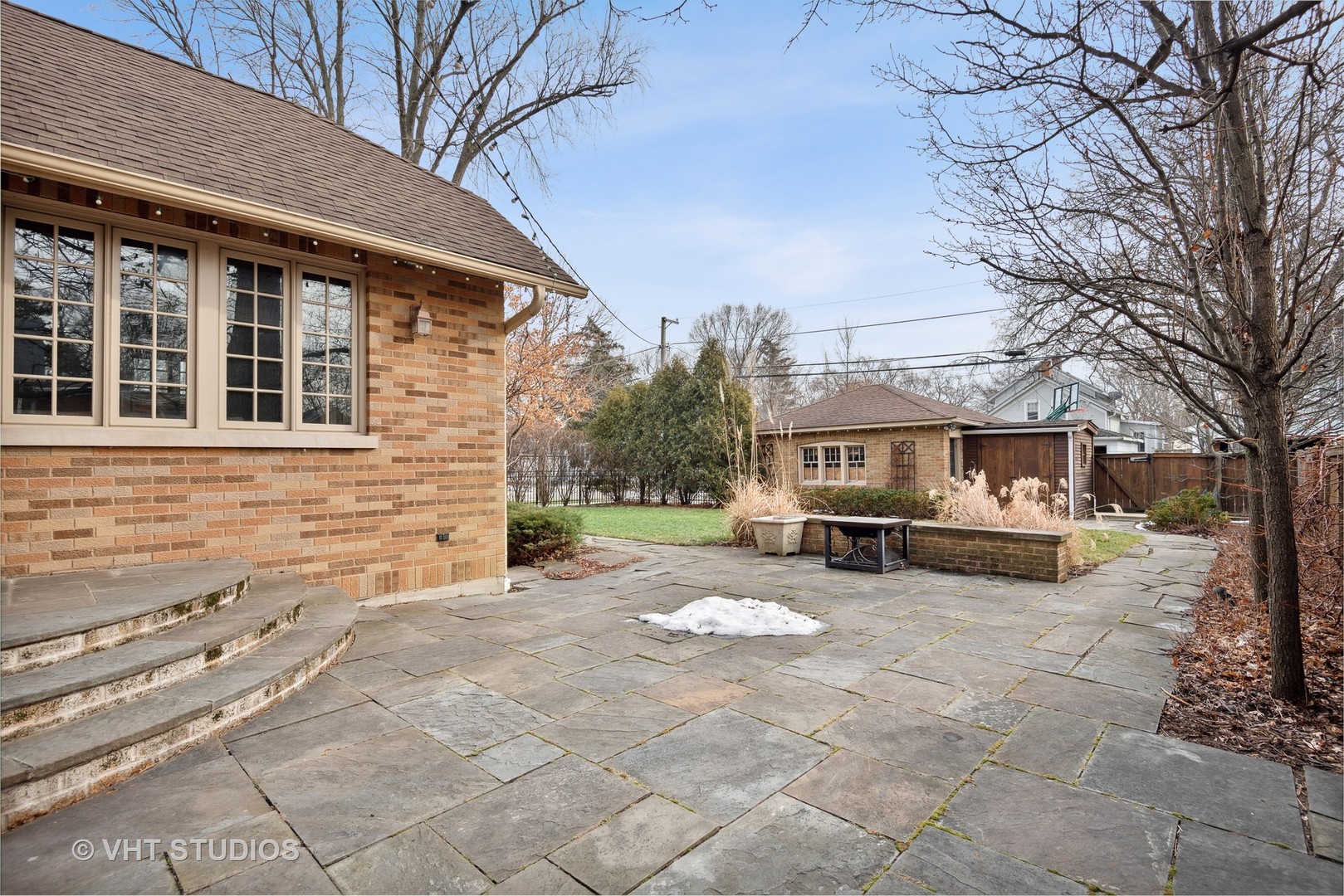 1601 Central Avenue Wilmette, IL 60091 - Photo 26 of 32 a front view of a house with yard covered in snow