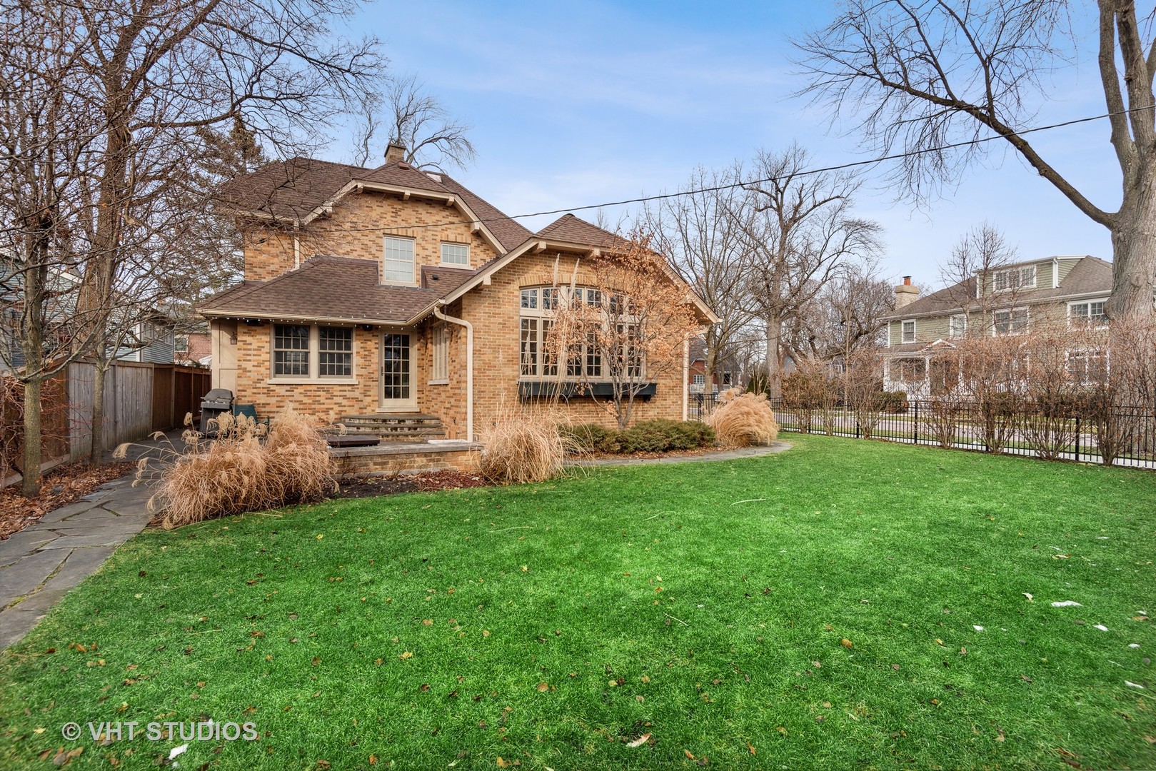 1601 Central Avenue Wilmette, IL 60091 - Photo 27 of 32 a front view of a house with a garden and a tree