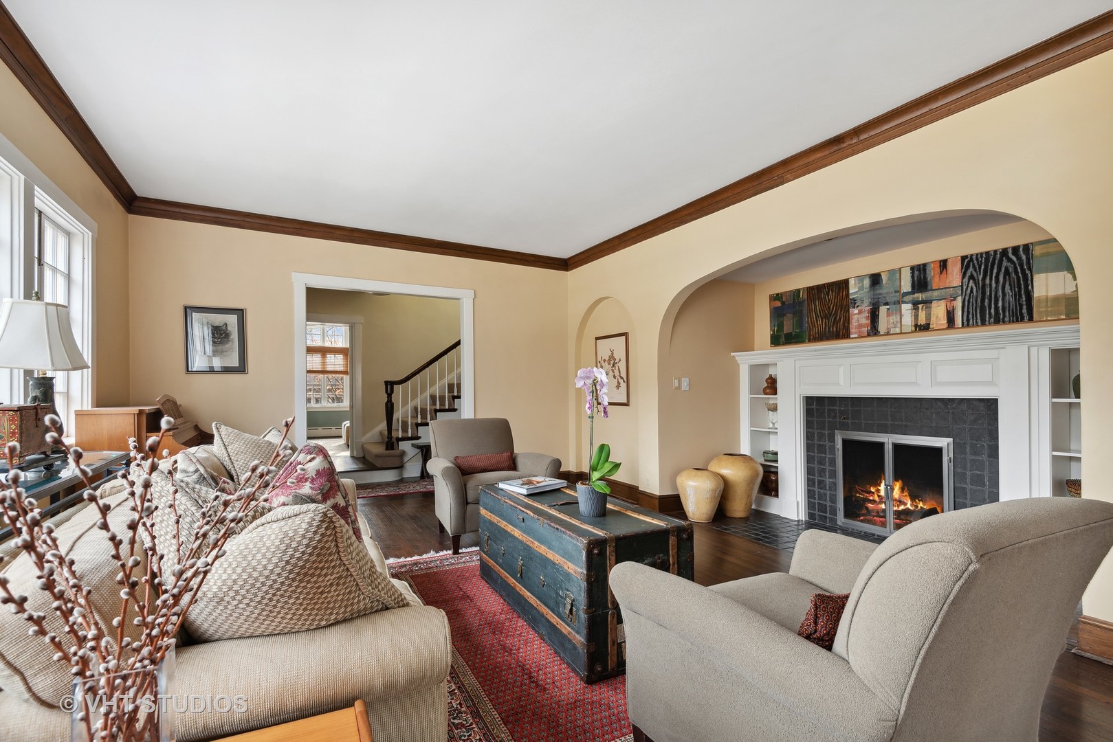 1601 Central Avenue Wilmette, IL 60091 - Photo 5 of 32 a living room with furniture a fireplace and a large window