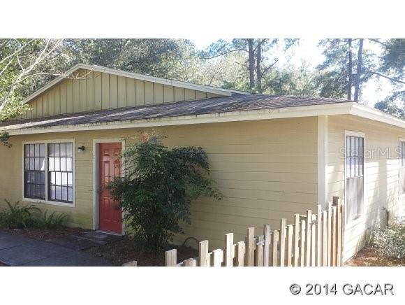 a black and white photo of a house