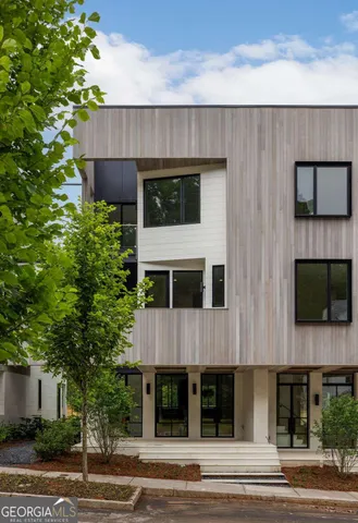 a front view of a house with a garage