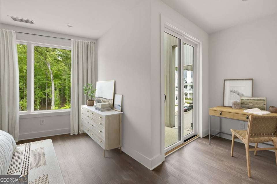 11554 Serenbe Lane Chattahoochee Hills, GA 30268 - Photo 5 of 16 a view of an empty room with a window and wooden floor