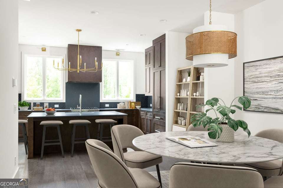 11554 Serenbe Lane Chattahoochee Hills, GA 30268 - Photo 7 of 16 a kitchen with a table and chairs in it