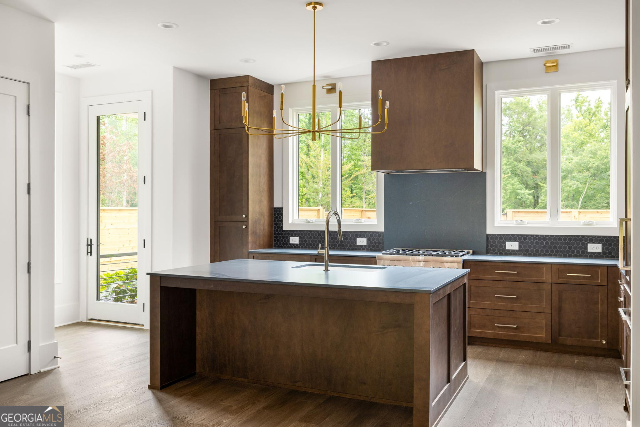 11554 Serenbe Lane Chattahoochee Hills, GA 30268 - Photo 8 of 16 a kitchen with a window a sink and a refrigerator