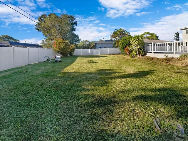 a view of swimming pool with seating space and garden