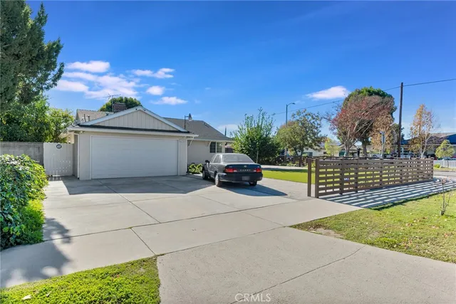 a view of a house with swimming pool and sitting area