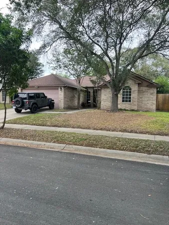 front view of house with a trees