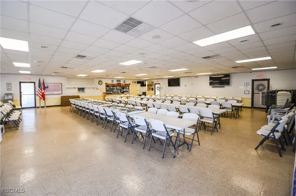 a very nice looking room with a large window and furniture