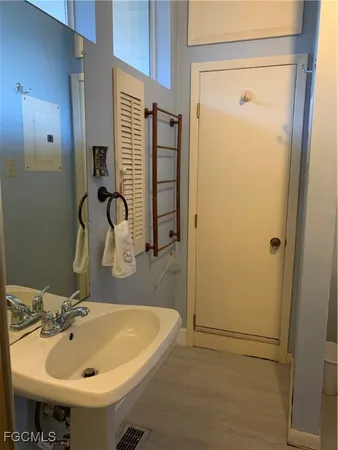 a bathroom with a sink and a mirror