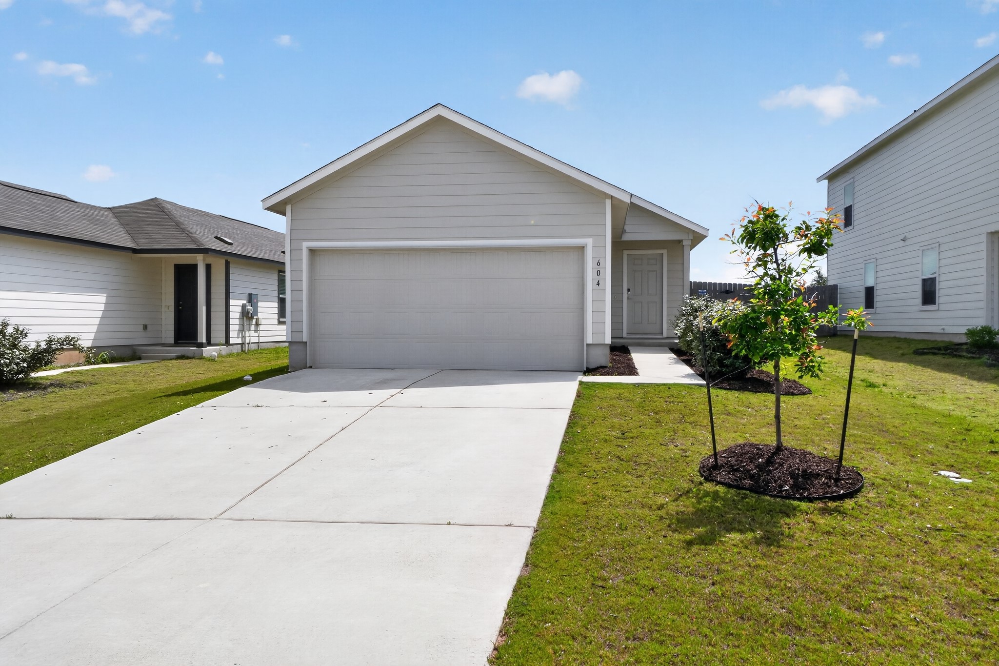 604 Marty Allen Loop Jarrell, TX 76537 - Photo 1 of 15 A well-maintained lawn and extended driveway welcome you to this charming single-story residence.