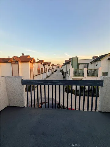 a view of balcony with furniture