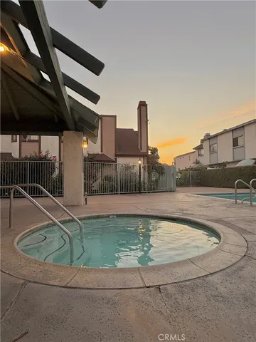 a view of a swimming pool with a yard