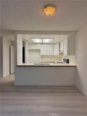 a close view of kitchen countertops with wooden floor