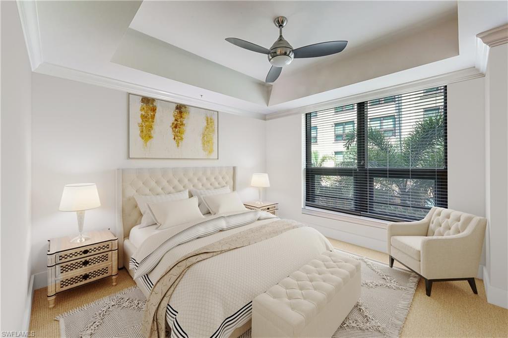 9123 Strada Place, Unit 7201 Naples, FL 34108 - Photo 16 of 50 a bedroom with a bed and a large window