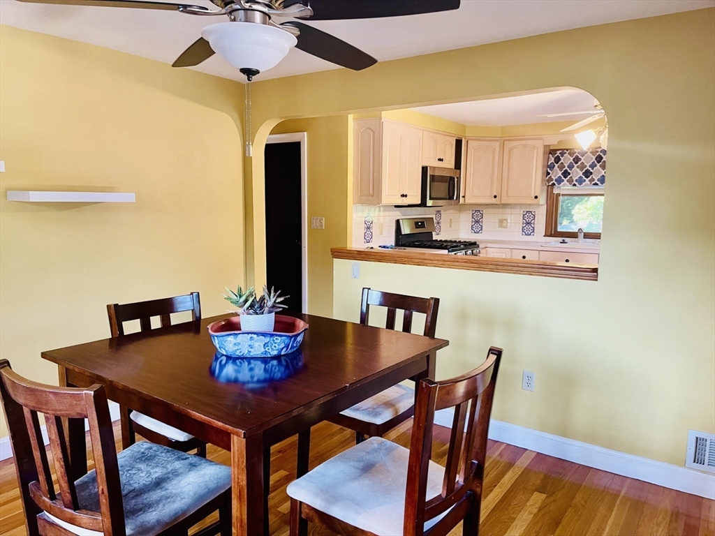52 Westview Road Lynn, MA 01902 - Photo 11 of 32 a view of a dining room with furniture and wooden floor