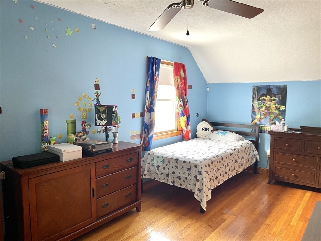 52 Westview Road Lynn, MA 01902 - Photo 18 of 32 a bedroom with a bed and a dresser