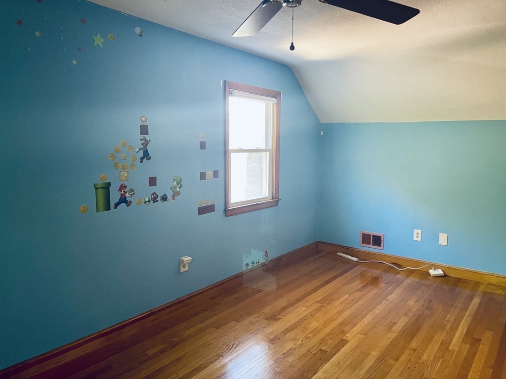 52 Westview Road Lynn, MA 01902 - Photo 19 of 32 an empty room with a window and ceiling fan