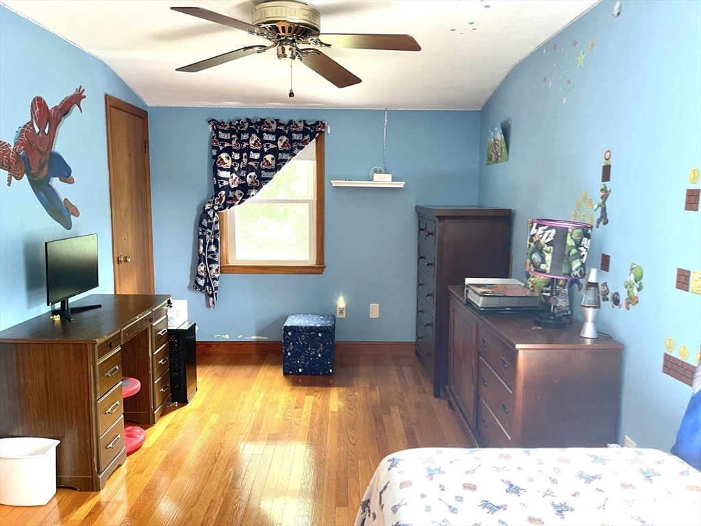 52 Westview Road Lynn, MA 01902 - Photo 20 of 32 a bedroom with a bed and wooden floor