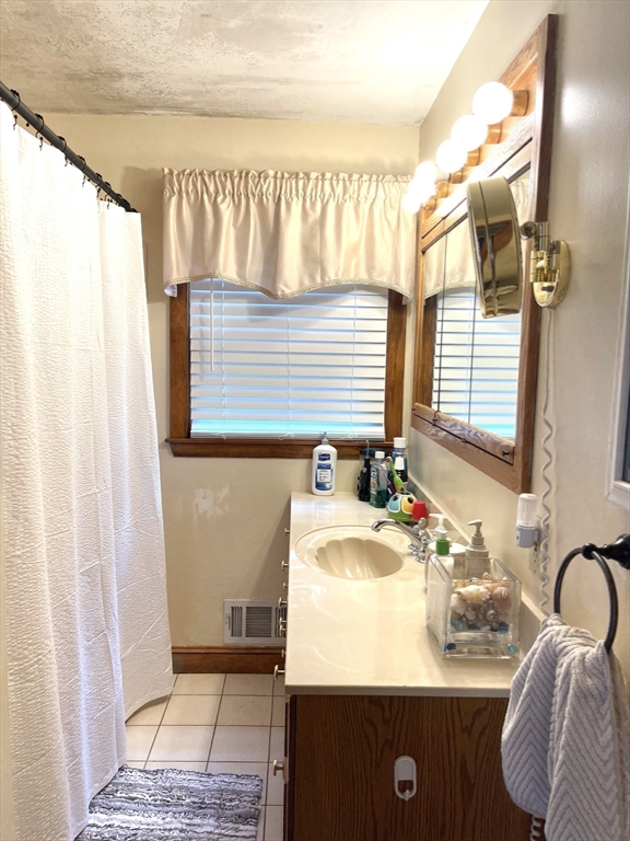 52 Westview Road Lynn, MA 01902 - Photo 26 of 32 a bathroom with a sink and a mirror